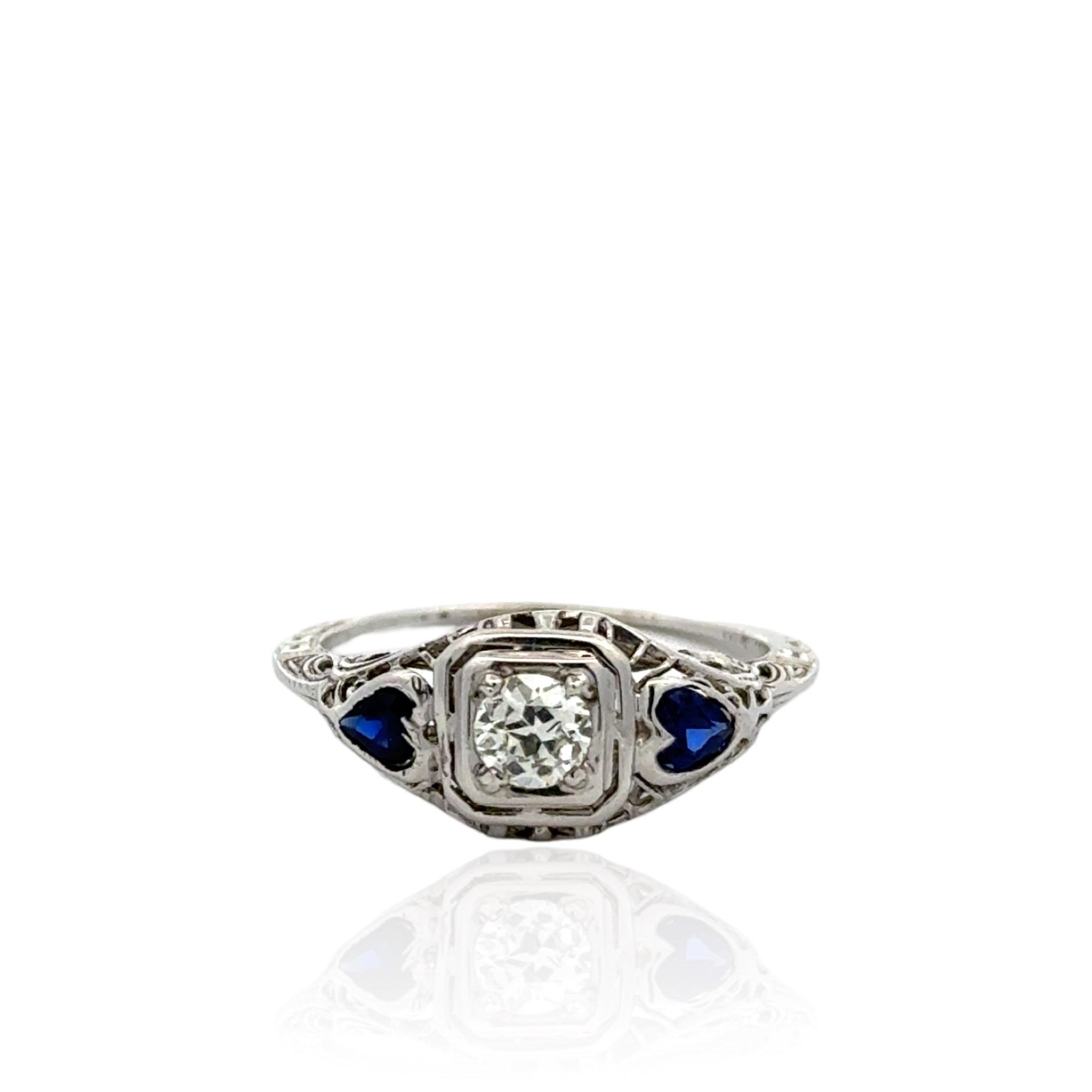 Vintage-Inspired Filigree Diamond Engagement Ring with Heart-Shaped Synthetic Sapphires