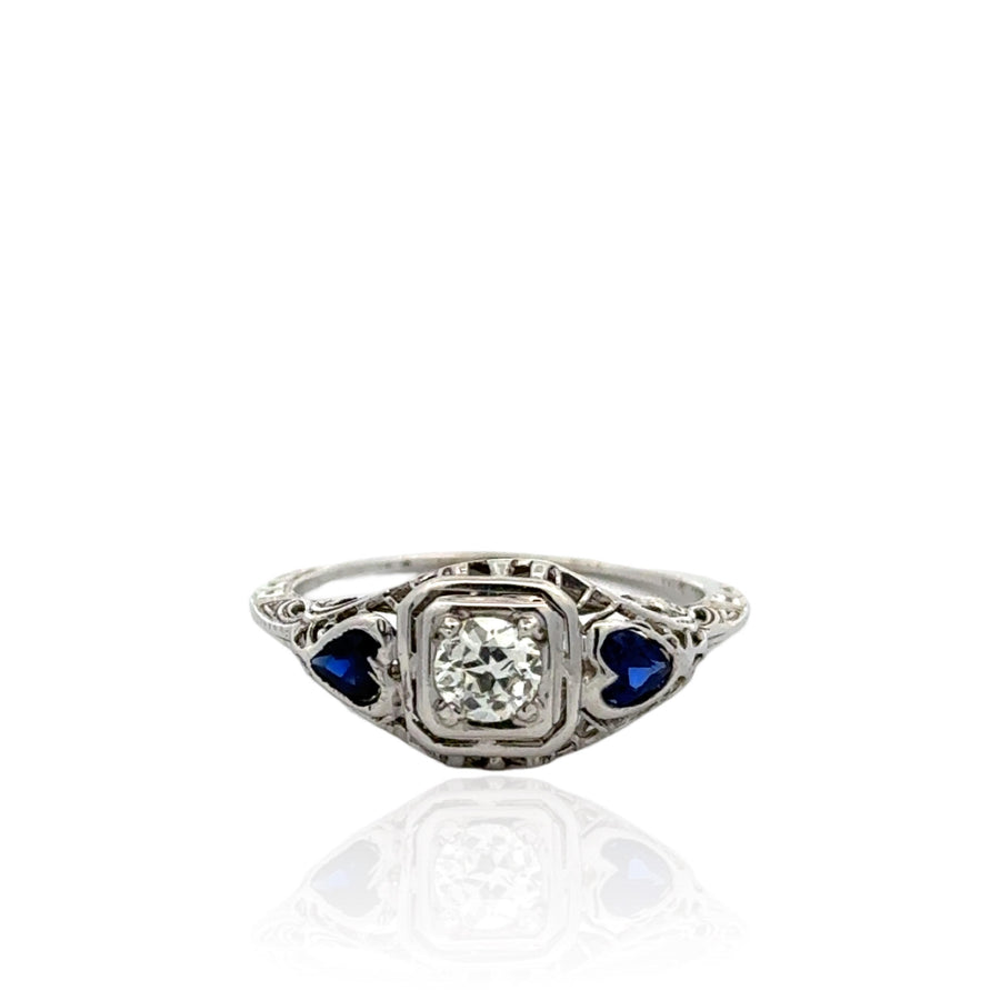 Vintage-Inspired Filigree Diamond Engagement Ring with Heart-Shaped Synthetic Sapphires
