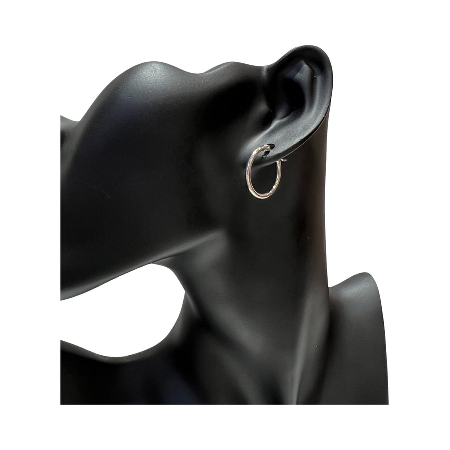 14 karat gold 2mm hoop earrings displayed on a black mannequin ear, showcasing a polished finish and latch back design.