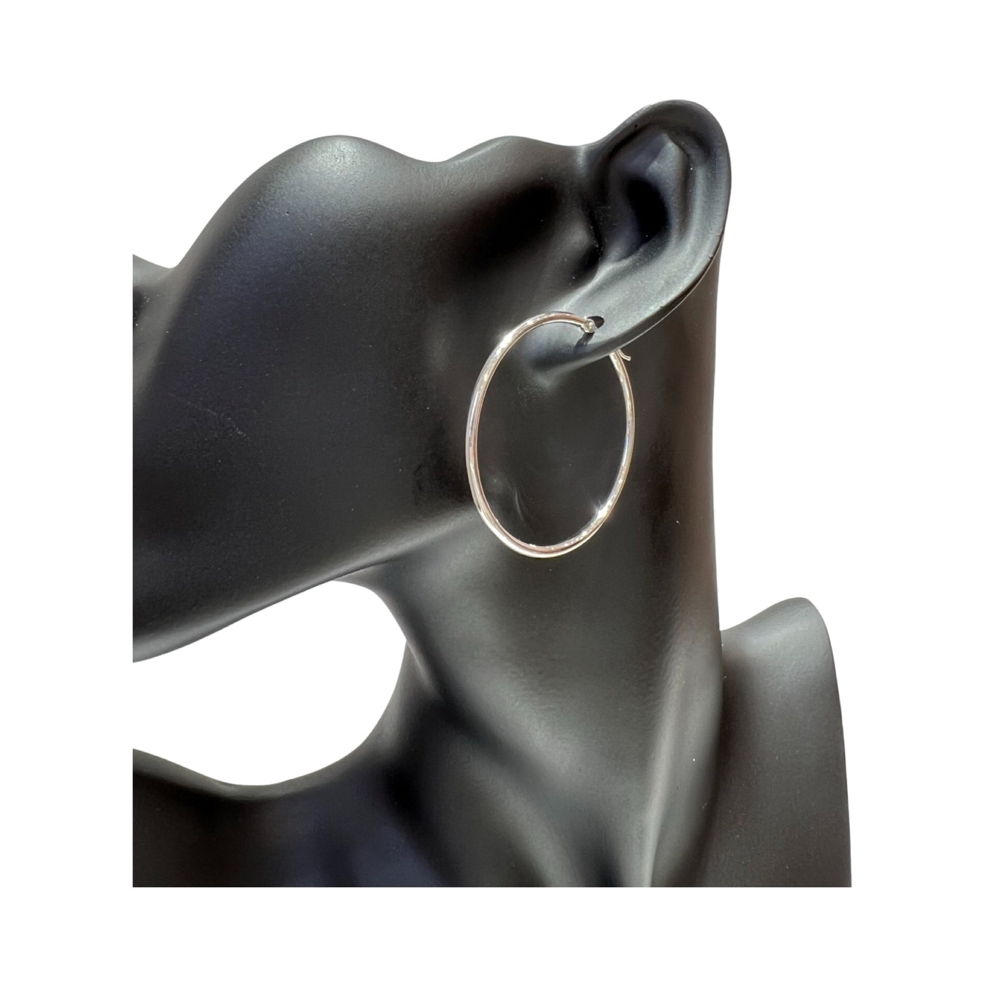 14K gold 2mm hoop earrings on display, showcasing a polished finish and stylish design, perfect for any occasion.