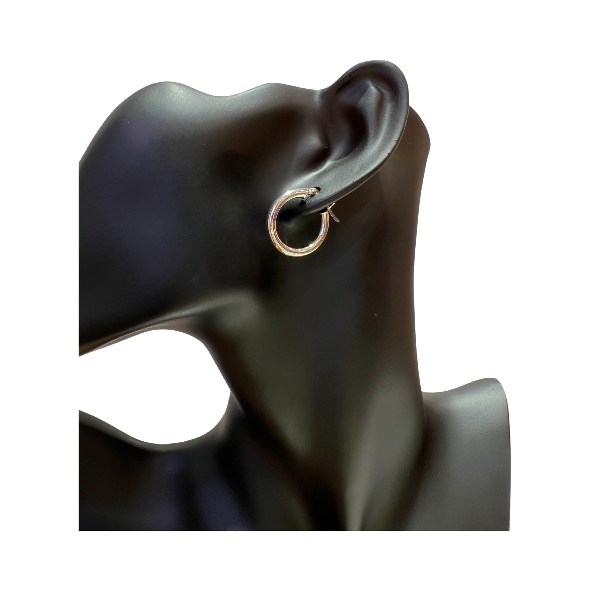 14 karat gold 3mm hoop earrings displayed on a mannequin's ear, high polished finish, classic design.