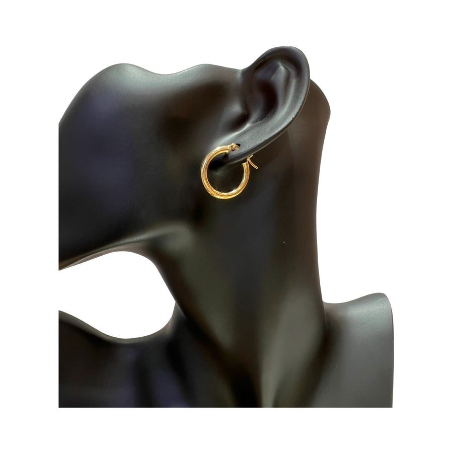 14 karat gold 3mm hoop earrings showcased on a model's ear, featuring a high polished finish and latch back closure.
