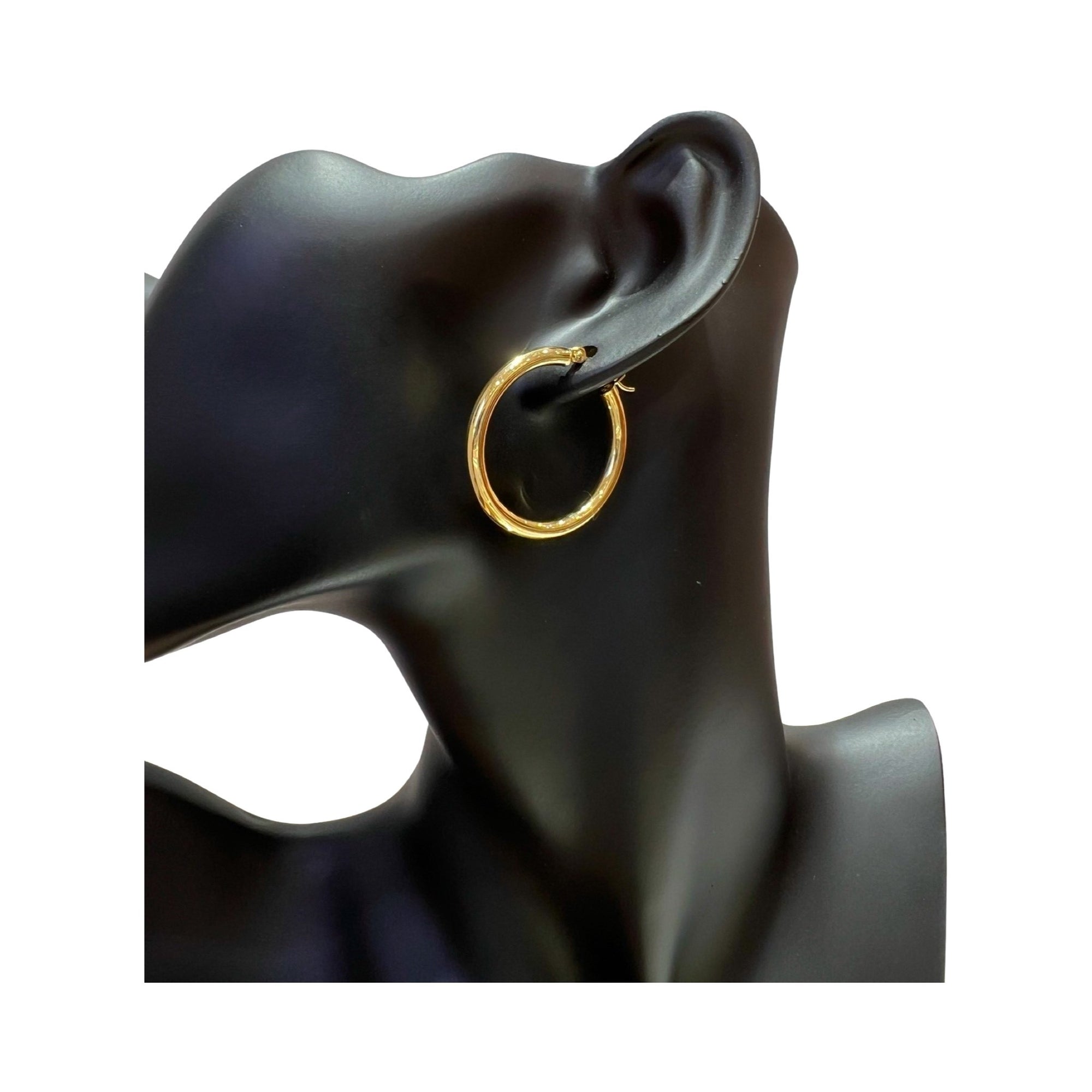 14 karat gold 3mm classic hoop earrings, high polish finish, model wearing, perfect for any occasion.
