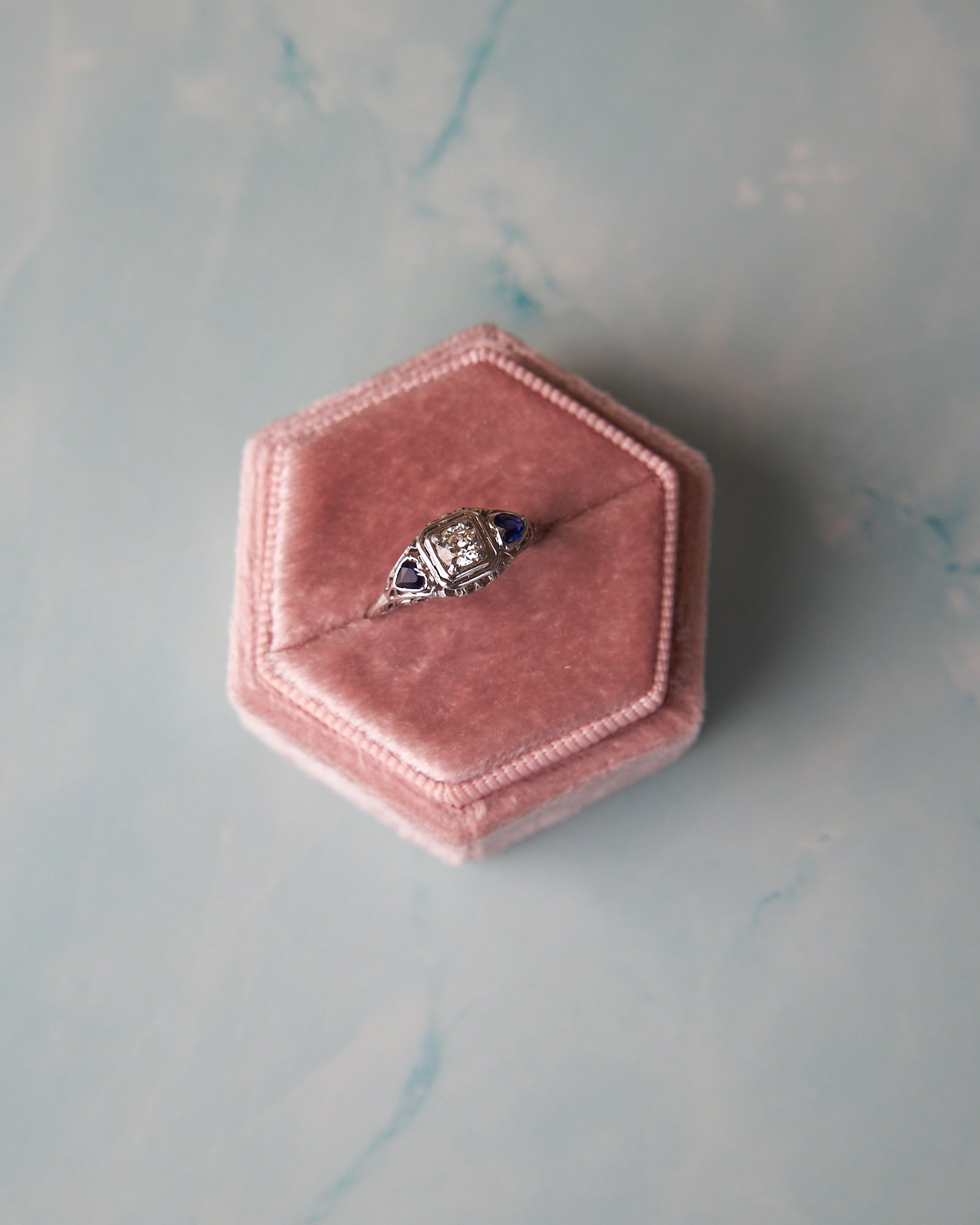 Vintage-Inspired Filigree Diamond Engagement Ring with Heart-Shaped Synthetic Sapphires