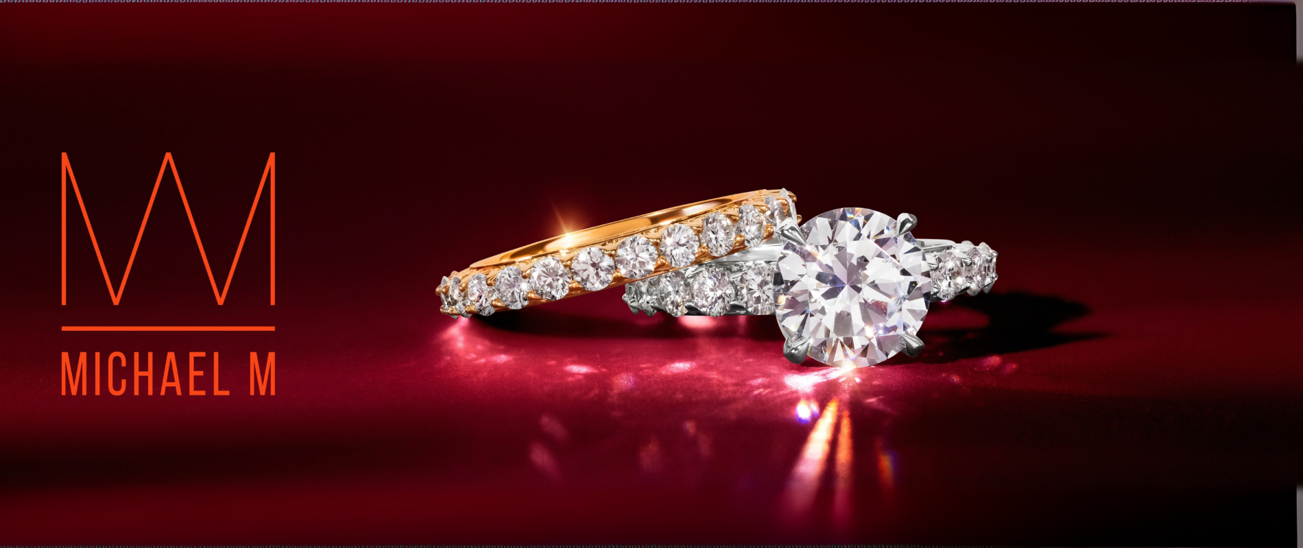 Two diamond rings on a red background with 'Michael M' branding.