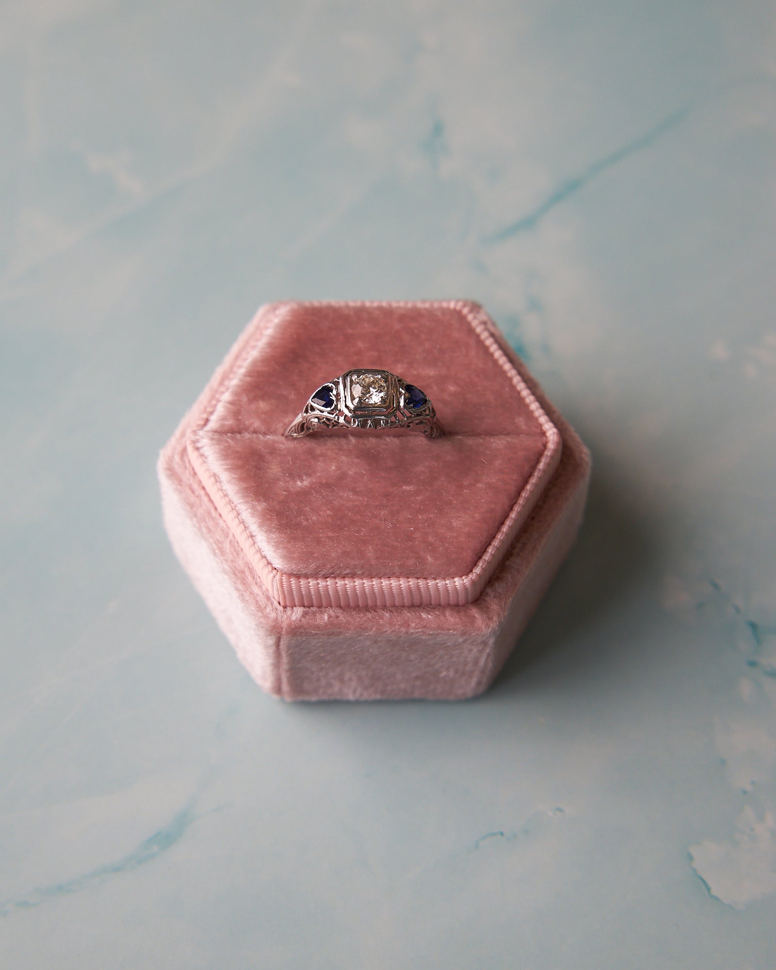 Vintage-Inspired Filigree Diamond Engagement Ring with Heart-Shaped Synthetic Sapphires