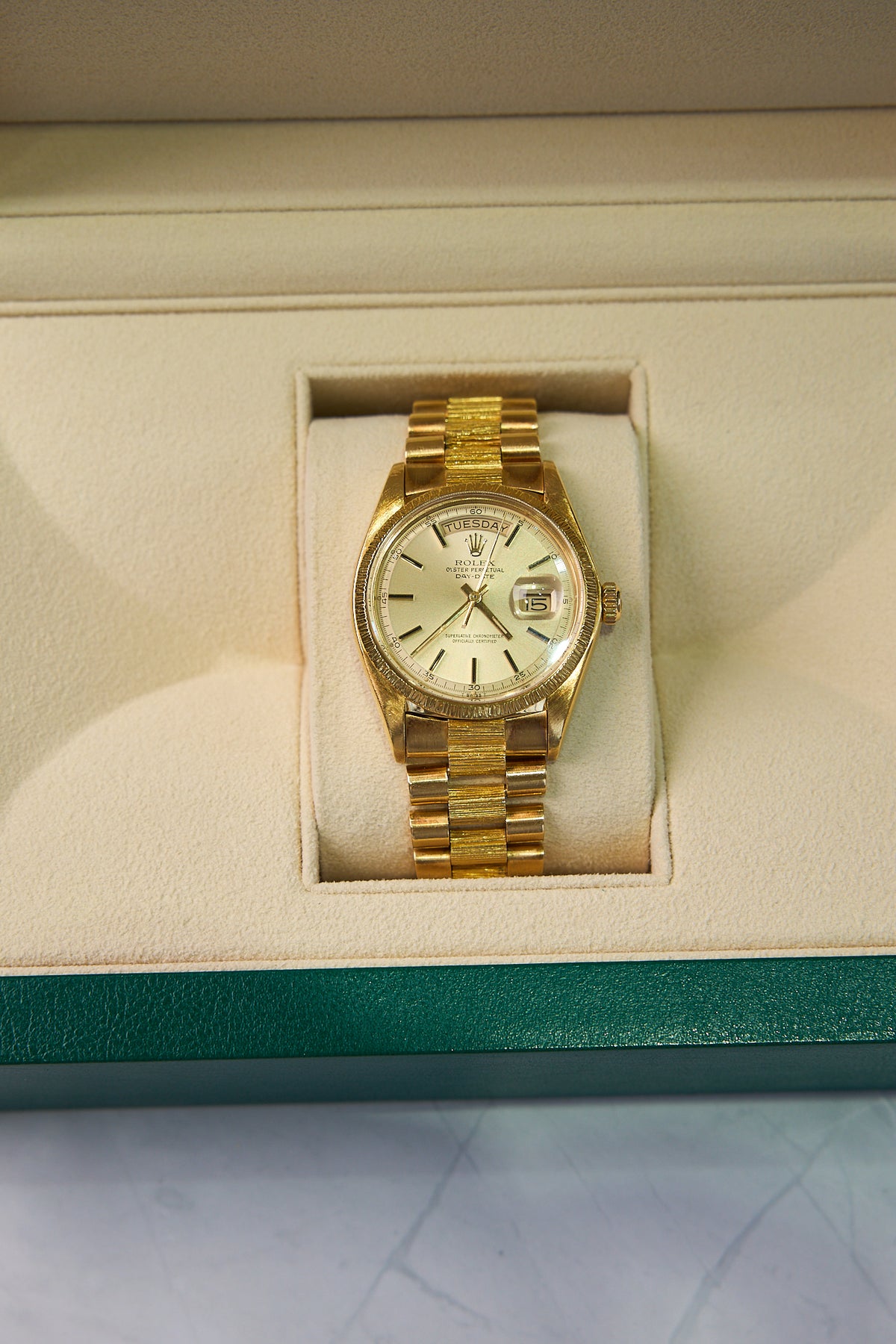 Pre-Owned Rolex Day-Date 36mm in 18K Yellow Gold, Bark Bezel – Ref. 1807 (1976)