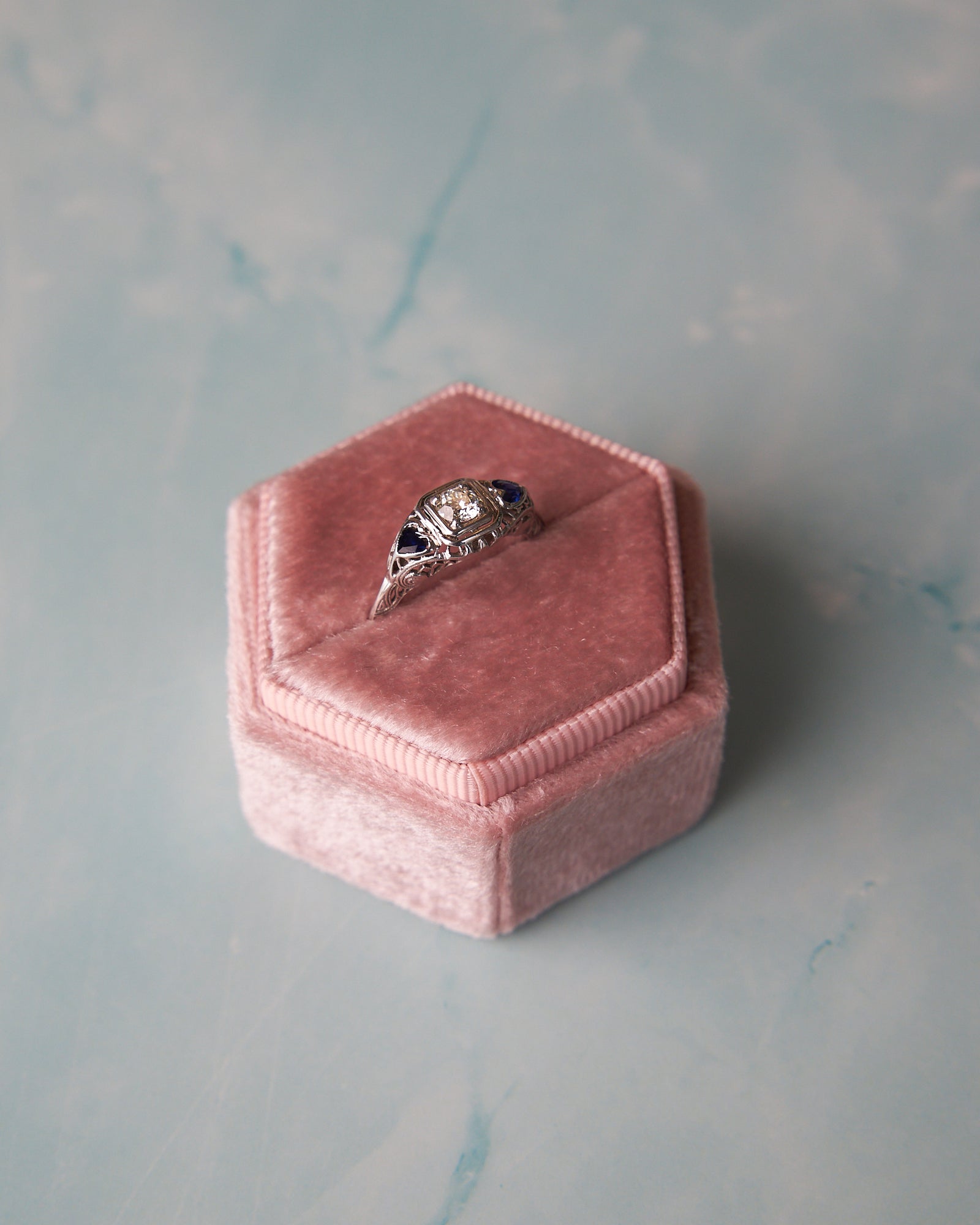 Vintage-Inspired Filigree Diamond Engagement Ring with Heart-Shaped Synthetic Sapphires